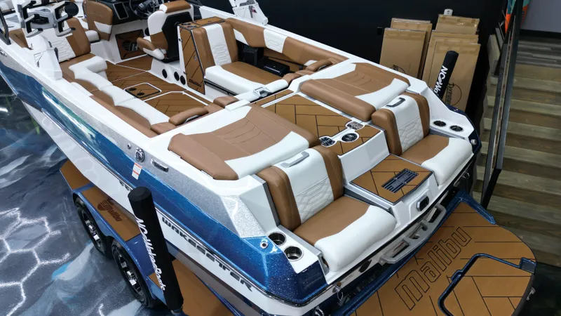 Slide: The Image of 2022 Malibu Wakesetter 25 LSV boat with luxurious seating and sleek design. - 19