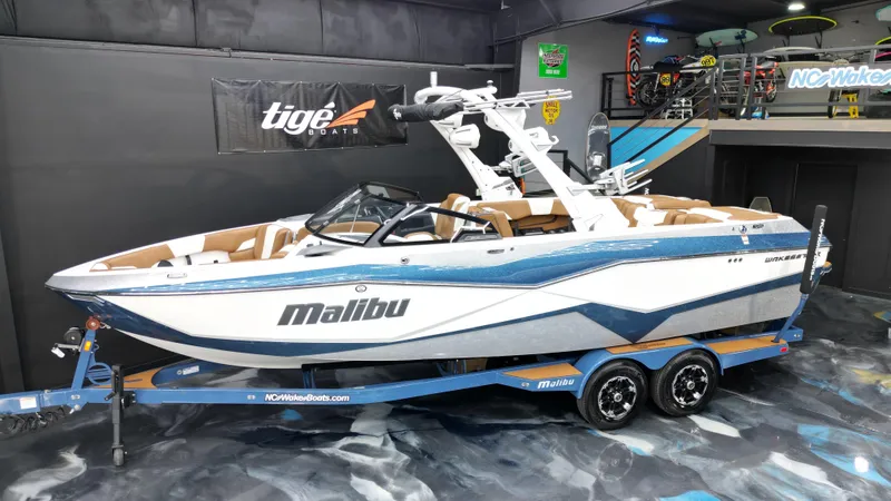 Slide: The Image of 2022 Malibu Wakesetter 25 LSV boat on trailer in showroom. - 3