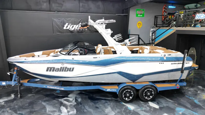 Slide: The Image of 2022 Malibu Wakesetter 25 LSV boat on trailer in showroom. - 4