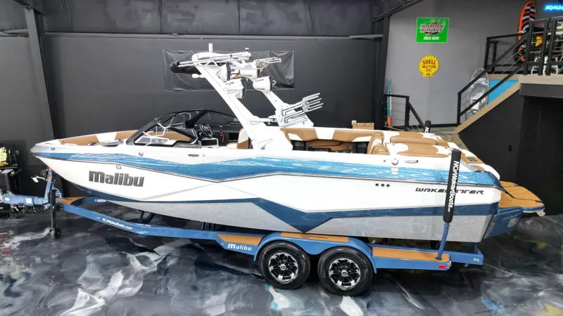 Slide: The Image of 2022 Malibu Wakesetter 25 LSV boat on trailer in showroom. - 5