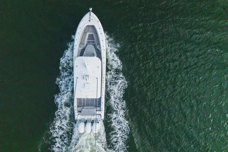 Slide: The Image of Aerial view of 2023 HCB 42 Lujo boat cruising on open water. - 10
