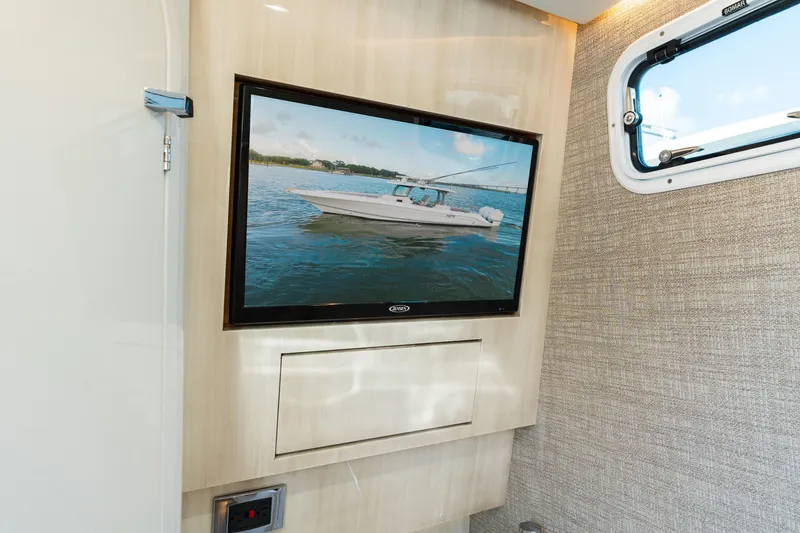 Slide: The Image of Interior of 2023 HCB 42 Lujo yacht with wall-mounted TV and window. - 24