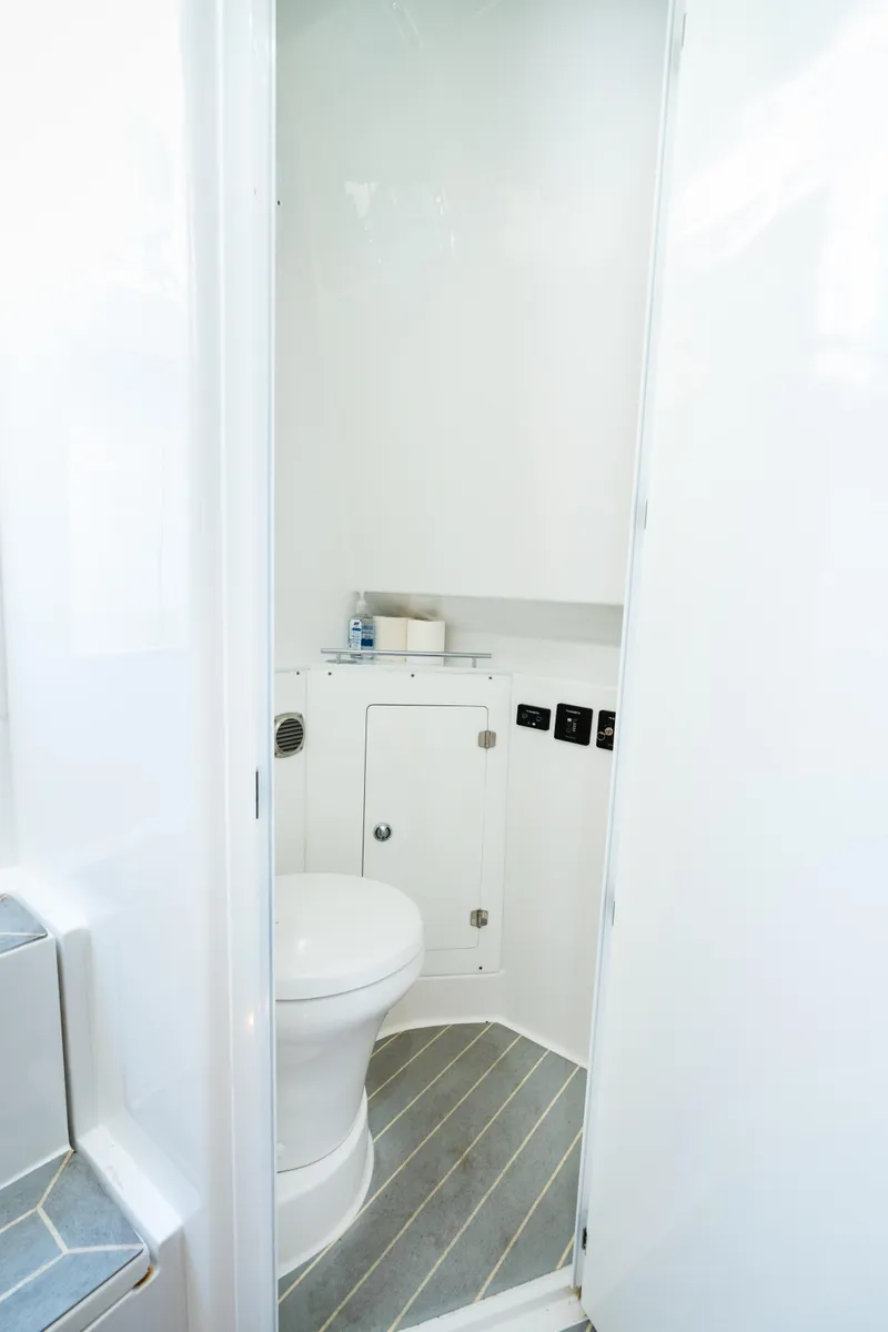 Slide: The Image of 2023 HCB 42 Lujo boat bathroom with modern white interior and compact design. - 32