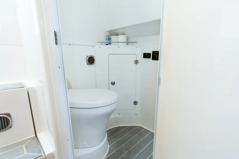 Slide: The Image of 2023 HCB 42 Lujo boat bathroom with modern white fixtures and compact design. - 33