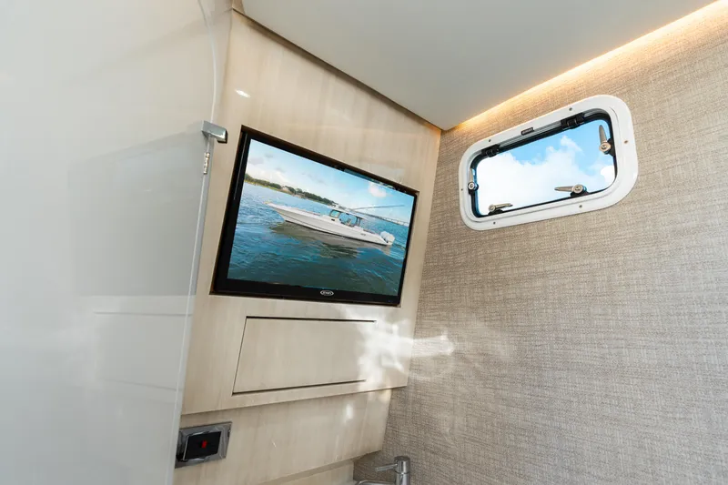 Slide: The Image of Interior of 2023 HCB 42 Lujo boat with TV and window view. - 37