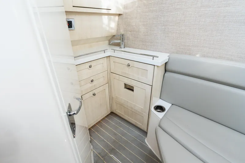 Slide: The Image of 2023 HCB 42 Lujo interior with modern cabinetry and seating. - 39