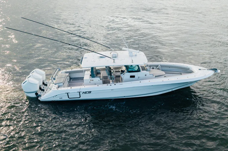 Slide: The Image of 2023 HCB 42 Lujo boat on water, featuring sleek design and powerful engines. - 4