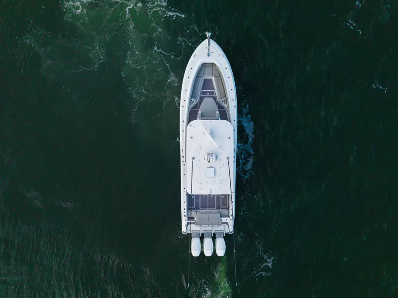 Slide: The Image of Aerial view of 2023 HCB 42 Lujo boat cruising on open water. - 47