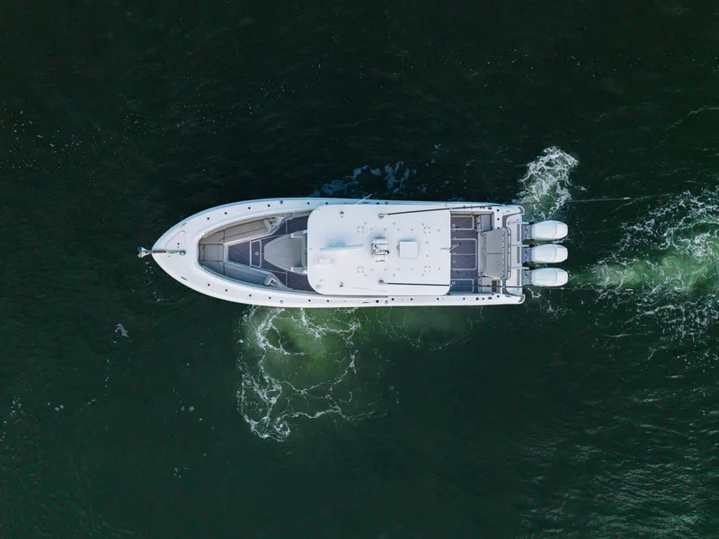 Slide: The Image of Aerial view of 2023 HCB 42 Lujo boat cruising on water. - 48