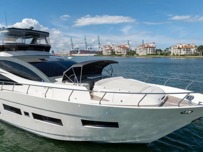 Slide: The Image of Luxury 2016 Astondoa 80 GLX yacht cruising near coastal cityscape. - 17
