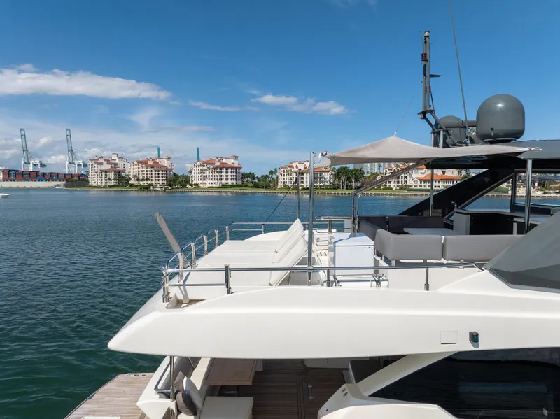 Slide: The Image of 2016 Astondoa 80 GLX yacht docked with cityscape background. - 18