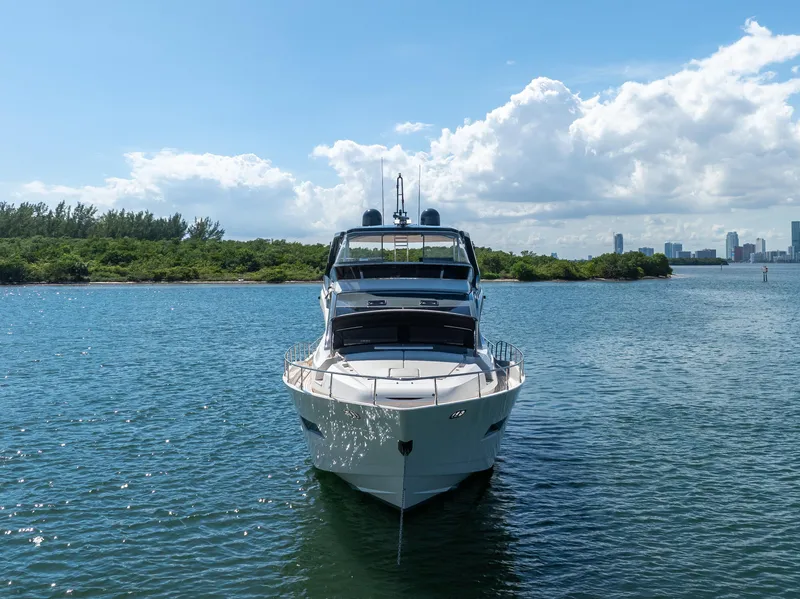 Slide: The Image of Astondoa 80 GLX 2016 yacht on serene water with city skyline in background. - 25