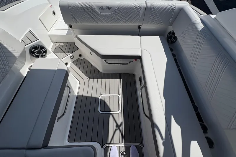 Slide: The Image of Luxurious seating area on 2026 Sea Ray SDX 270 Outboard boat, featuring elegant upholstery and flooring. - 12