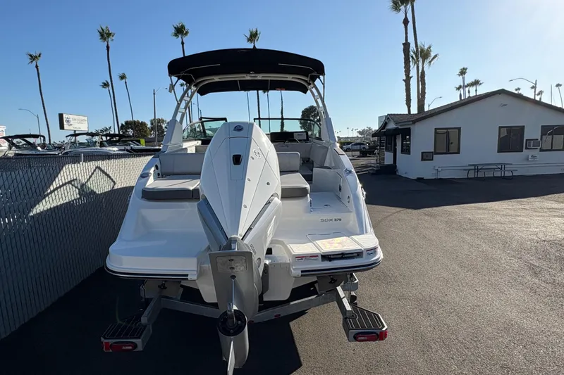 Slide: The Image of 2026 Sea Ray SDX 270 Outboard boat parked outdoors, showcasing sleek design and modern features. - 3