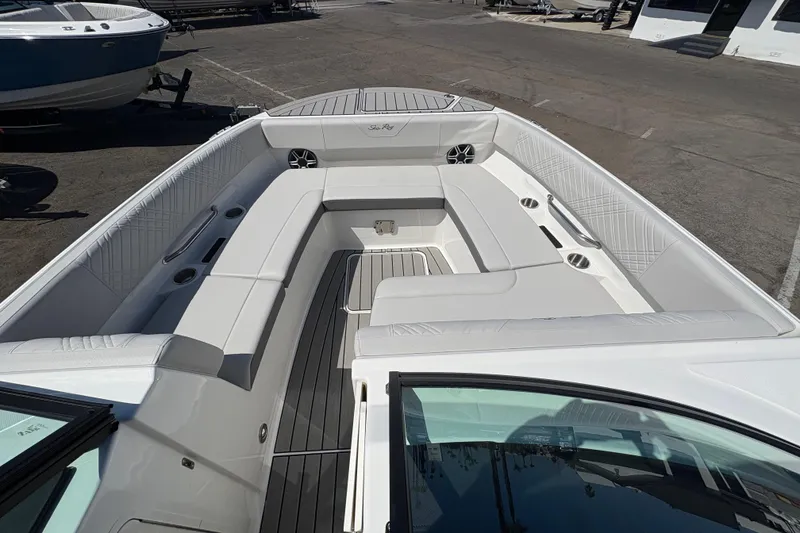 Slide: The Image of 2026 Sea Ray SDX 270 Outboard boat interior with spacious seating and modern design. - 6