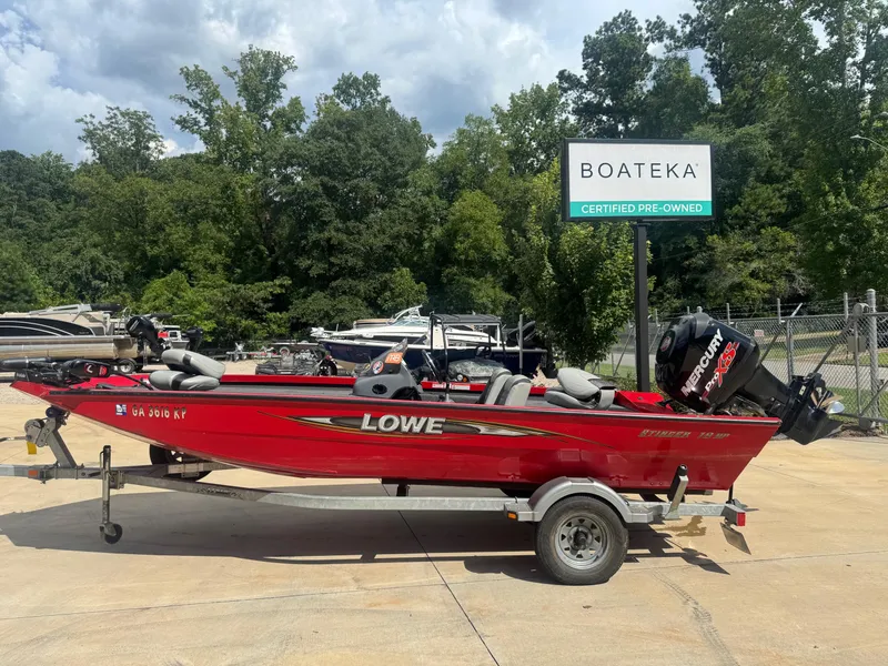 Slide: The Image of 2014 Lowe Stinger 18 HP boat on trailer at Boateka, certified pre-owned. - 0