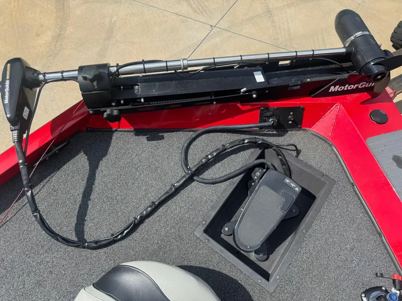 Slide: The Image of 2014 Lowe Stinger 18 HP boat with MotorGuide trolling motor on red deck. - 6