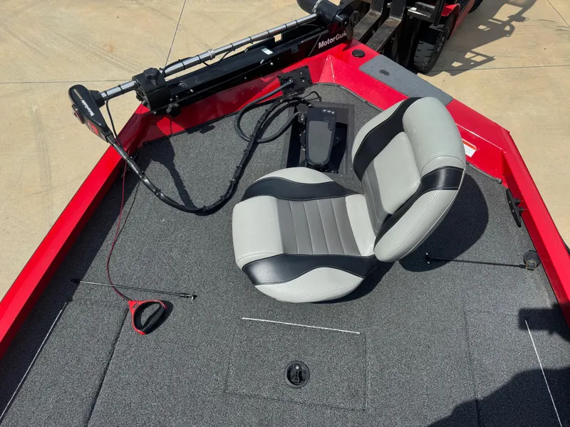 Slide: The Image of 2014 Lowe Stinger 18 HP boat interior with gray seat and trolling motor. - 7