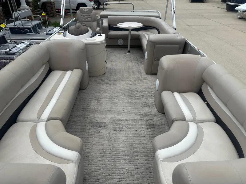 Slide: The Image of 2010 Crest II LM 22 pontoon boat with spacious seating and modern interior design. - 3