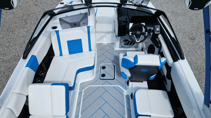 Slide: The Image of 2025 Malibu Wakesetter 23 LSV interior with modern design and blue accents. - 10