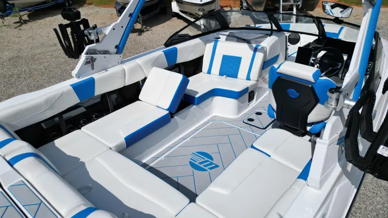 Slide: The Image of 2025 Malibu Wakesetter 23 LSV interior with blue and white seating, modern design. - 19