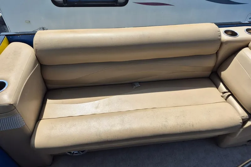 Slide: The Image of 2021 Bahama 240 Tritoon Coral Reef boat with motor and seating area. - 13