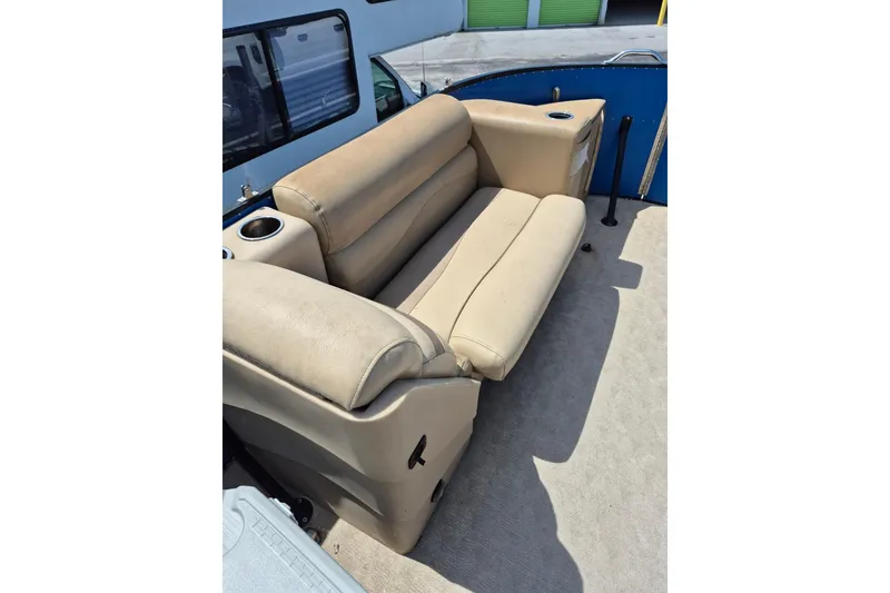 Slide: The Image of Beige seat on 2021 Bahama 240 Tritoon Coral Reef boat, showing wear and sunlight. - 17