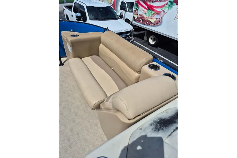 Slide: The Image of Beige seating on 2021 Bahama 240 Tritoon Coral Reef boat with cup holders. - 18