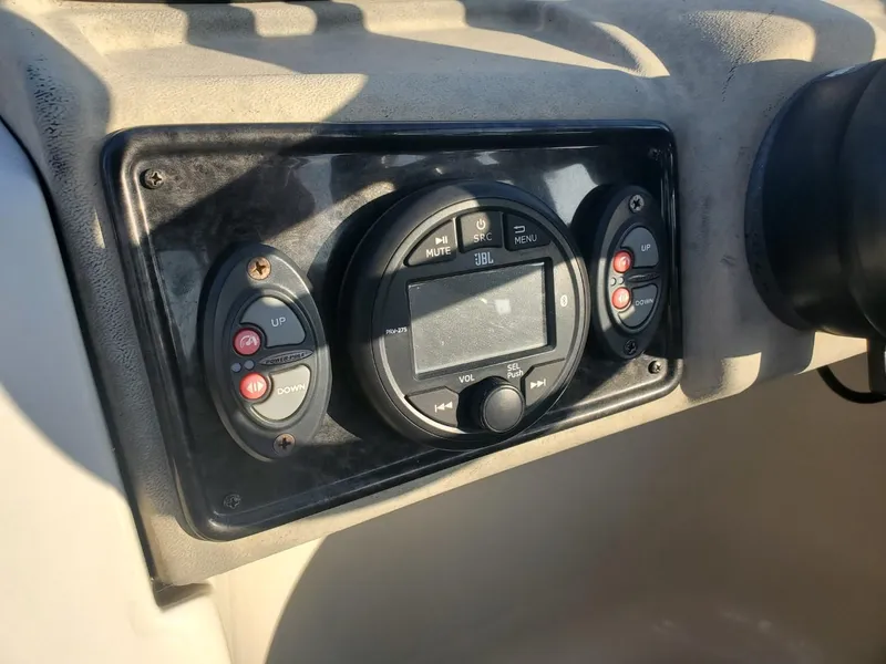 Slide: The Image of 2021 Bahama 240 Tritoon Coral Reef boat with motor and swim ladder. - 5