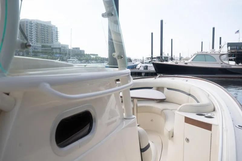 Slide: The Image of 2019 Hunt Yachts 32 Center Console at marina, featuring sleek design and comfortable seating. - 30