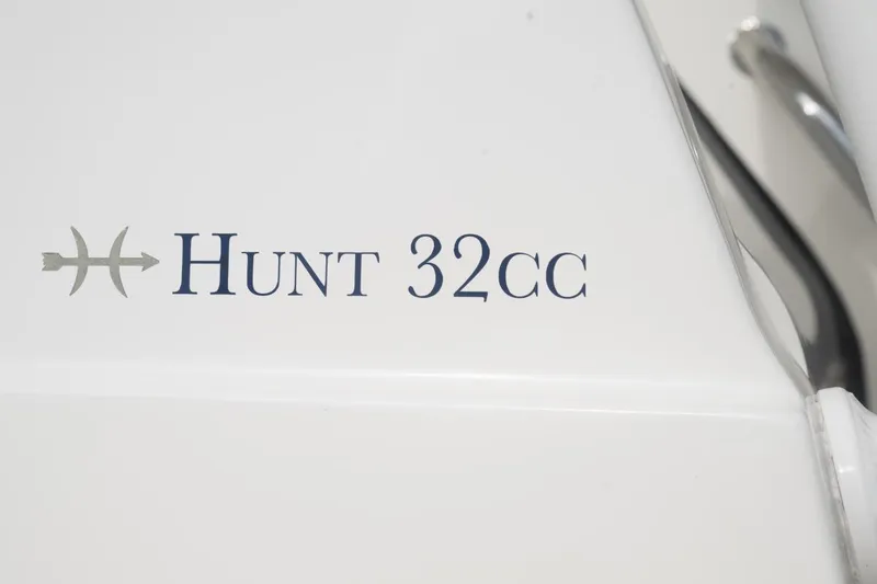 Slide: The Image of Hunt Yachts 32 Center Console 2019 logo on white surface. - 45