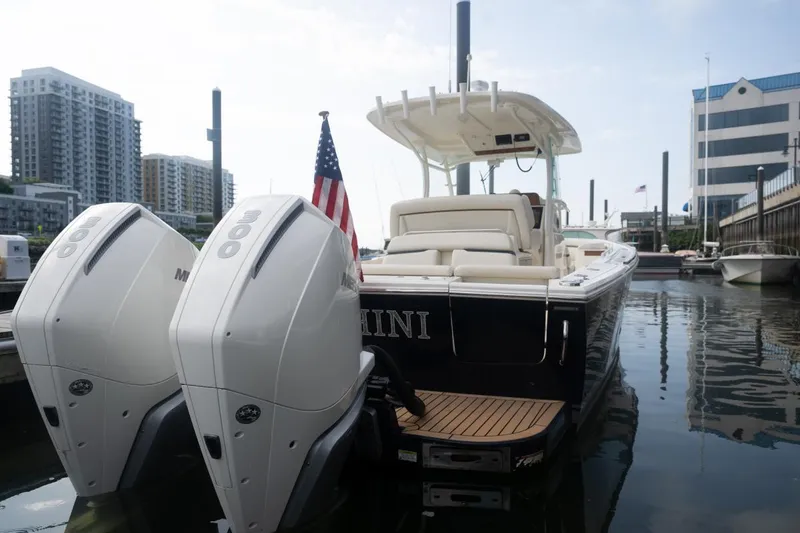Slide: The Image of 2019 Hunt Yachts 32 Center Console docked with twin Mercury engines. - 47