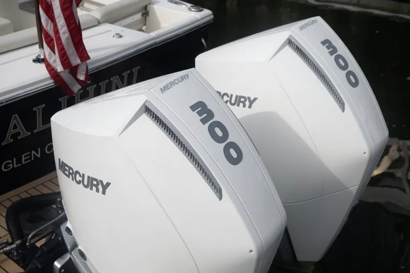 Slide: The Image of Twin Mercury 300 outboard engines on a 2019 Hunt Yachts 32 Center Console. - 48