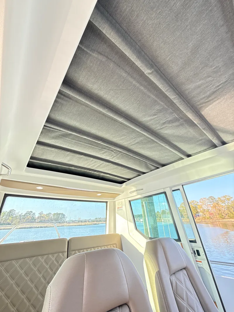 Slide: The Image of Interior view of 2019 Axopar 28 CABIN with sunroof and leather seats. - 48