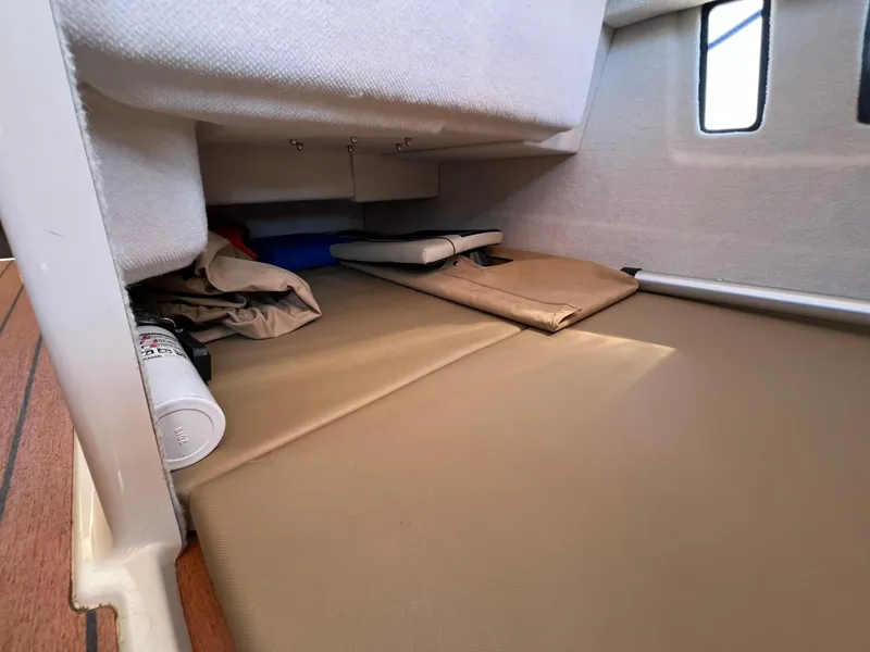 Slide: The Image of Interior cabin storage of 2020 Ranger Tugs R-27 boat with cushions and equipment. - 15