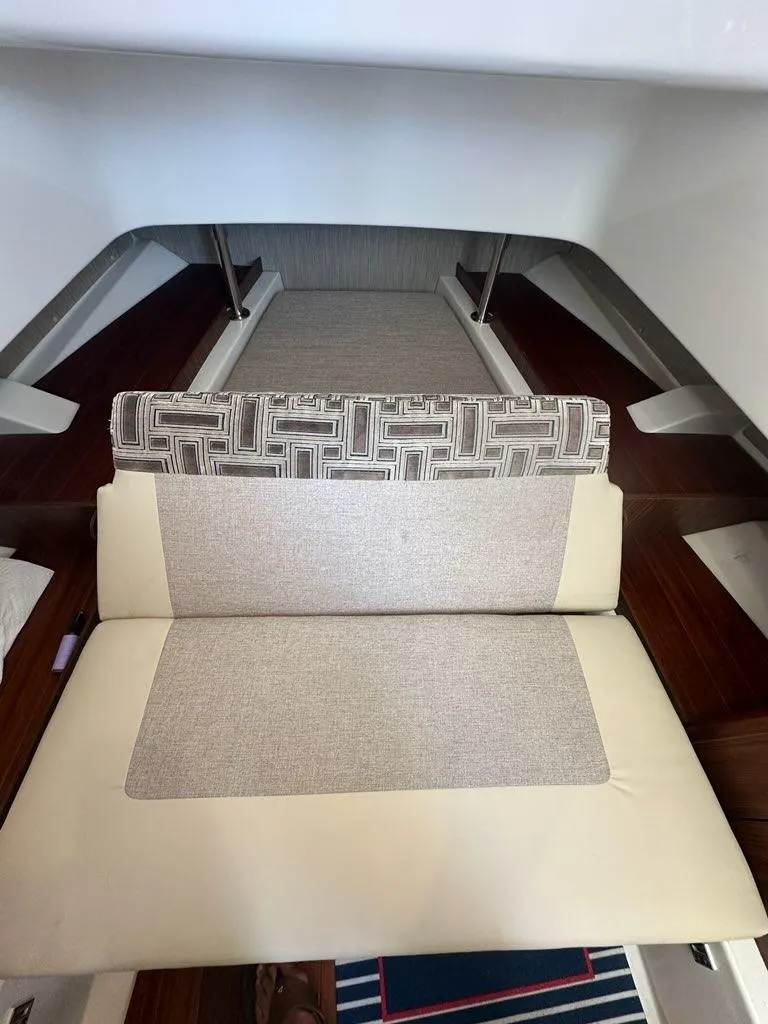 Slide: The Image of 2022 Pursuit S 328 Sport interior with cushioned seating and modern design. - 20