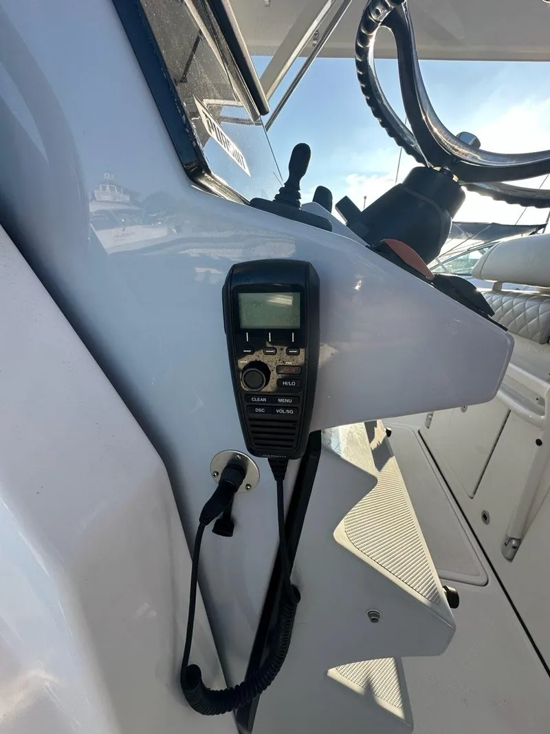 Slide: The Image of Control panel of 2022 Pursuit S 328 Sport boat with radio equipment. - 7