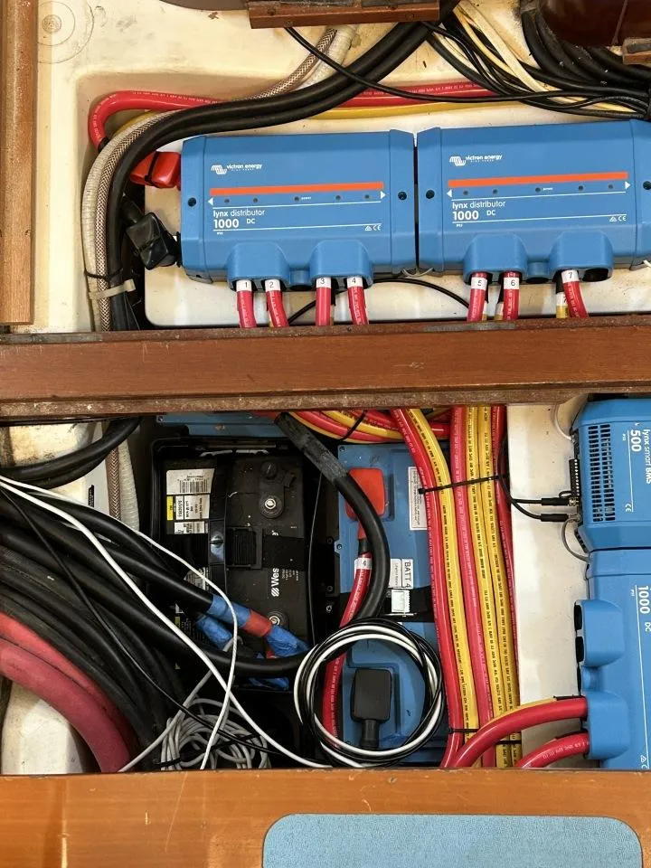 Slide: The Image of Electrical system of a 2006 Beneteau Oceanis 523 sailboat, featuring wiring and power distribution units. - 11