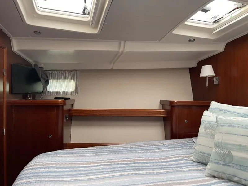 Slide: The Image of Luxurious cabin interior of 2006 Beneteau Oceanis 523 yacht with skylights and cozy bedding. - 14