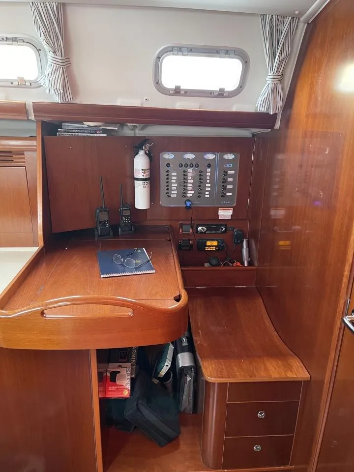 Slide: The Image of Navigation station of 2006 Beneteau Oceanis 523 yacht with control panel and equipment. - 6