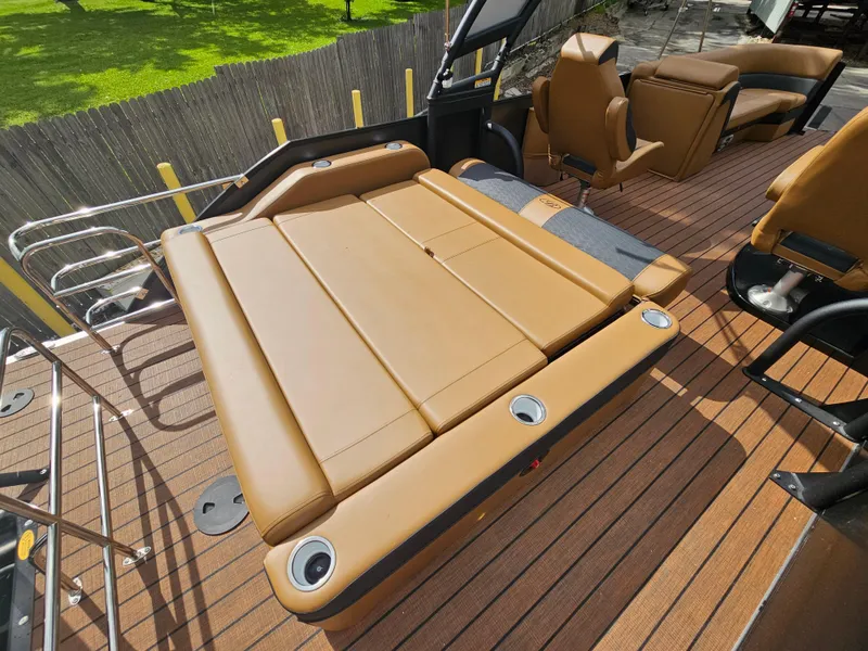 Slide: The Image of 2026 Bentley Pontoons Elite 253 Swingback with luxurious tan seating and sleek deck design. - 21