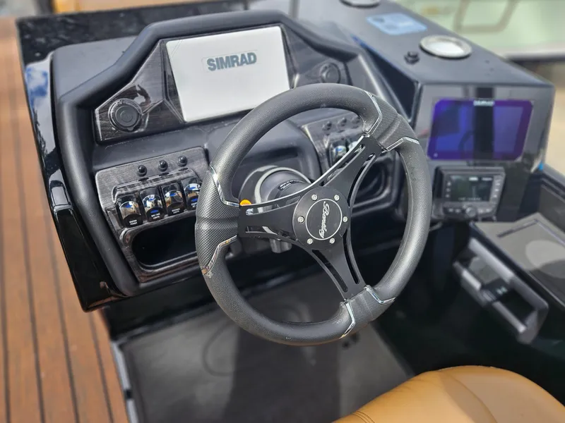 Slide: The Image of Steering console of 2026 Bentley Pontoons Elite 253 Swingback with Simrad display. - 23