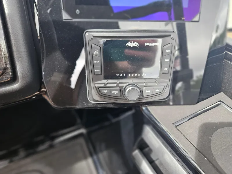 Slide: The Image of Control panel of 2026 Bentley Pontoons Elite 253 Swingback with Wet Sounds audio system. - 24