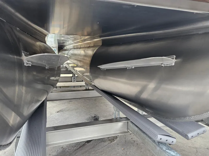 Slide: The Image of Close-up of 2026 Bentley Pontoons Elite 253 Swingback pontoons on a trailer. - 31