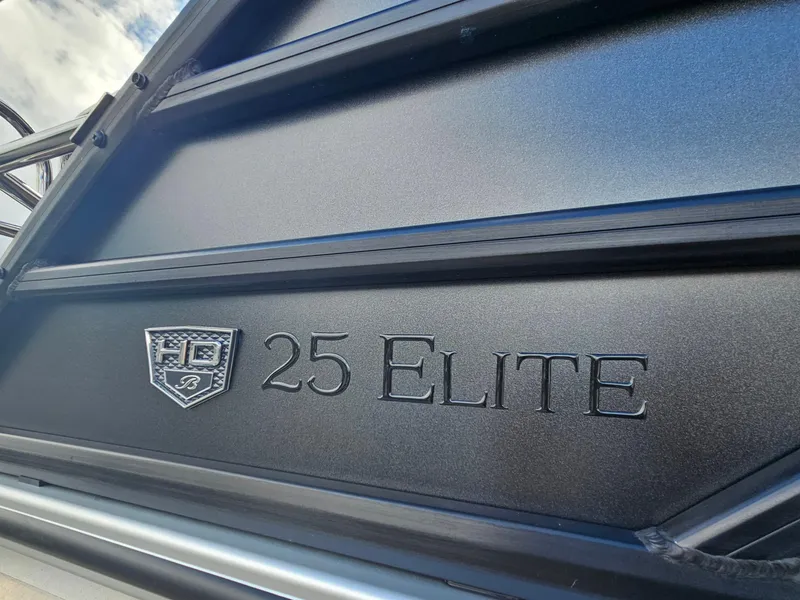 Slide: The Image of 2026 Bentley Pontoons Elite 253 Swingback logo on sleek black surface. - 6