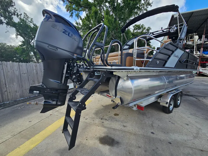 Slide: The Image of 2026 Bentley Pontoons Elite 253 Swingback with Suzuki outboard motor on trailer. - 9