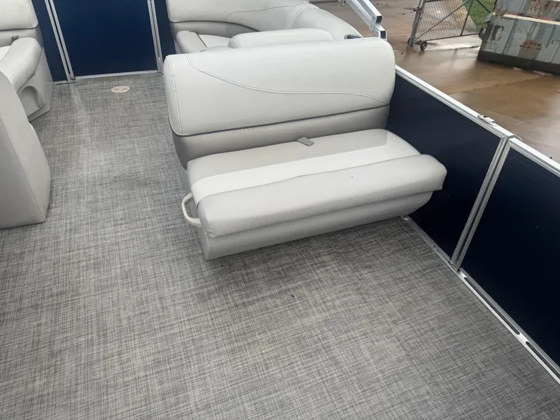 Slide: The Image of 2022 Cypress Cay Seabreeze 232 boat interior with gray seating and flooring. - 6