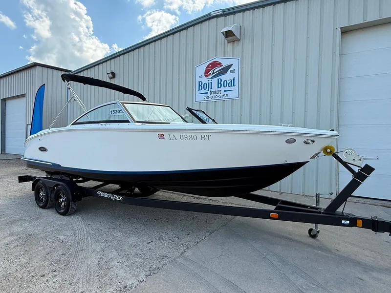 Slide: The Image of 2019 Cobalt CS23 boat on trailer outside Boji Boat Brokers building. - 1