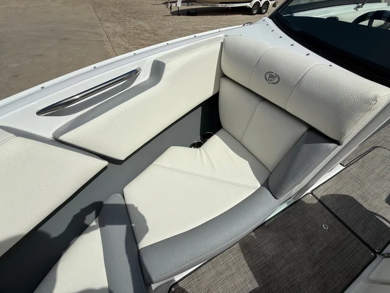Slide: The Image of 2019 Cobalt CS23 boat interior with white and gray cushioned seating. - 14