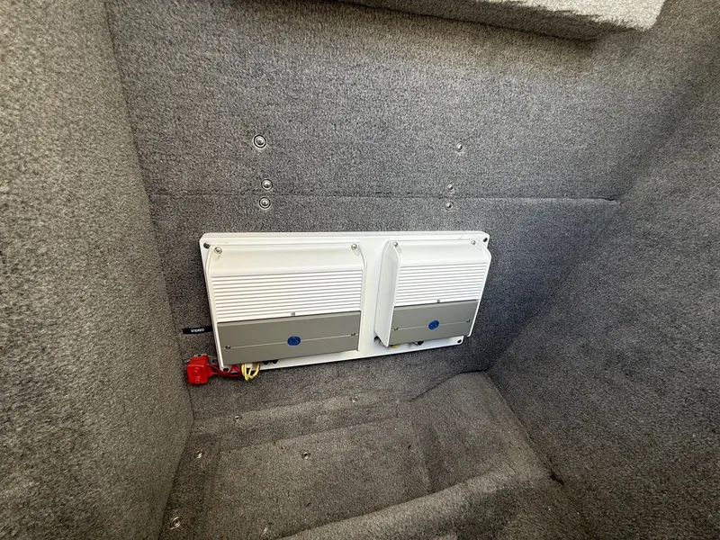 Slide: The Image of 2019 Cobalt CS23 interior with mounted electronic components on carpeted wall. - 18